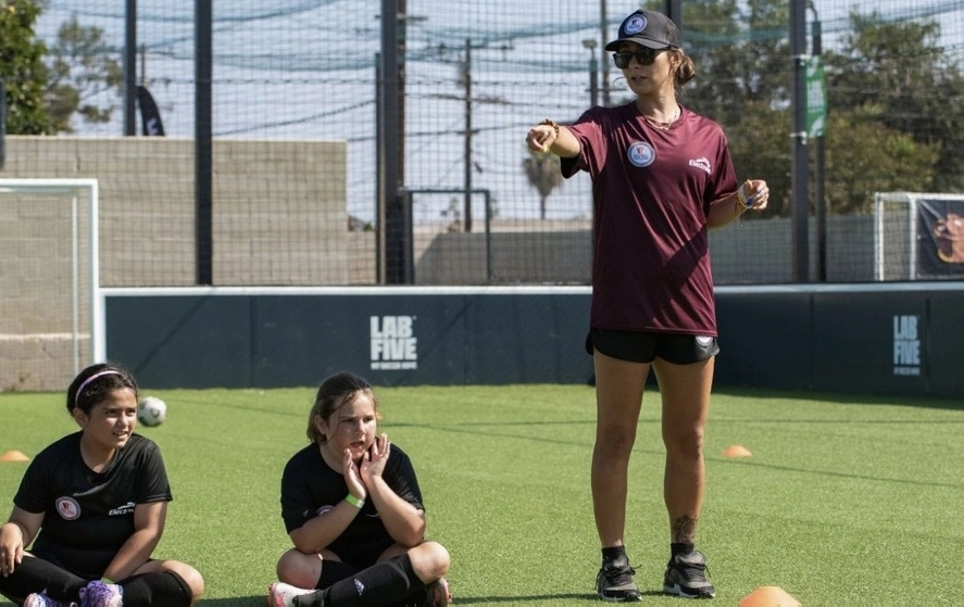 Experienced football mentor teaching